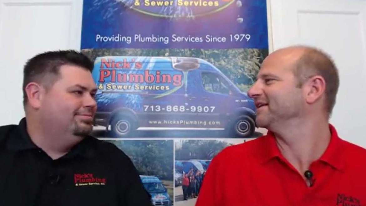 Two of Nick's Plumbing Experts in Houston Smiling and Looking at Each Other