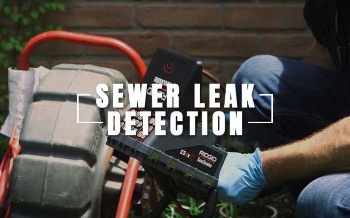 Professional Plumber Working to Detect a Sewer Leak