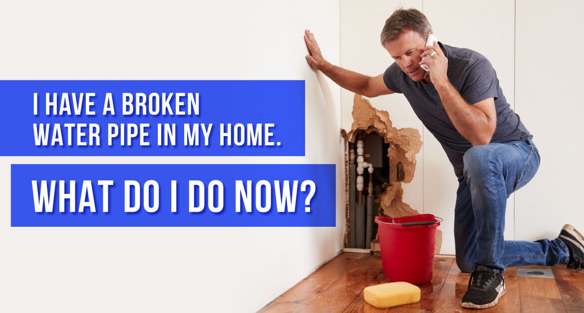 Man Calling a Plumber after Finding a Broken Pipe in the Wall