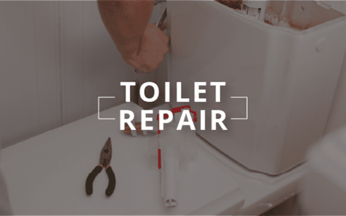 Person repairing a toilet