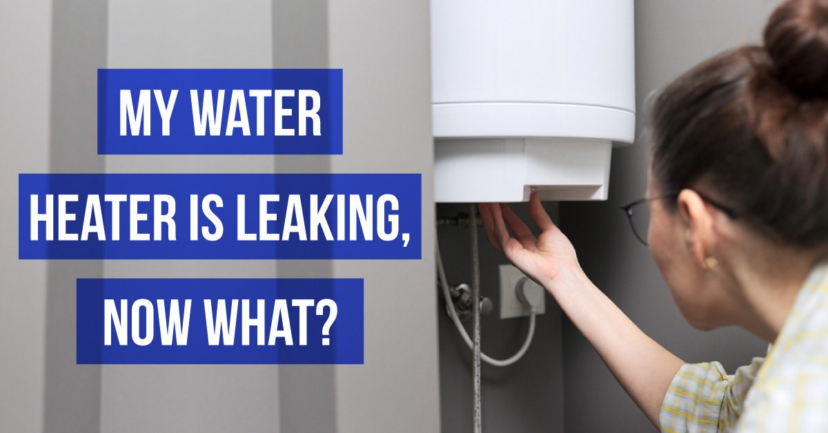 Woman Checking on a Water Heater for Leaks